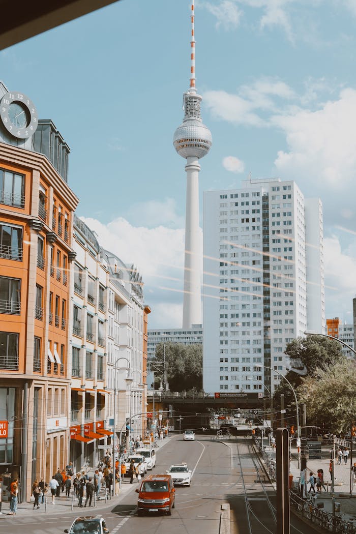 A vibrant view of Berlin's cityscape highlighting the Fernsehturm Tower under a clear blue sky.